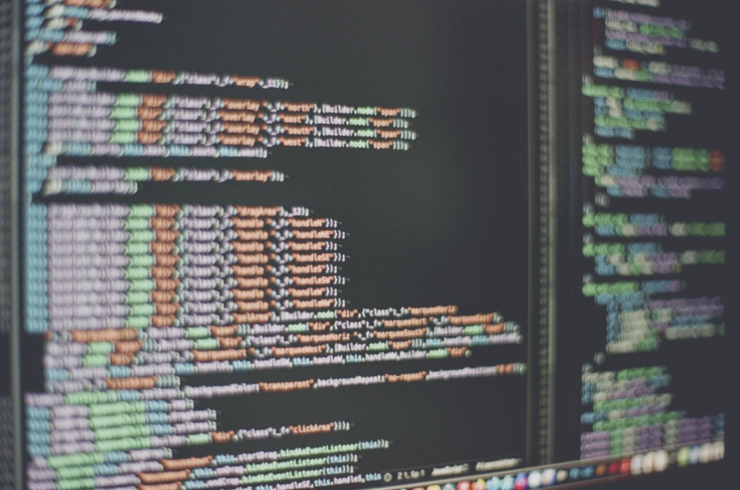 Advanced coding workspace with multiple monitors showing complex application architecture